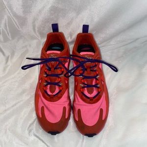 pink and red nike react